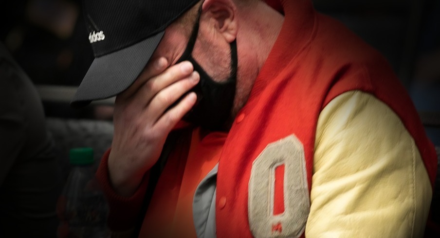 Gary Avis wipes tears away as he listens to another former Ohio State athlete, who said they were sexually abused by university physician Richard Strauss decades ago addressed Ohio State's Board of Trustees, at the Longaberger Alumni House during the board of trustees' public full board meeting, Thursday, November 15, 2021